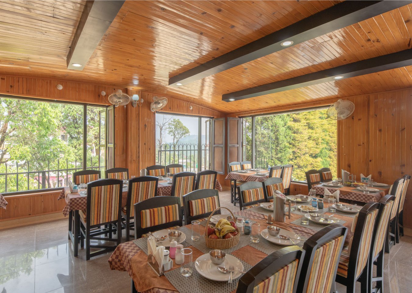 Experience fine dining at Ojaswi Resort’s restaurant in Mukteshwar, featuring panoramic Himalayan valley views.