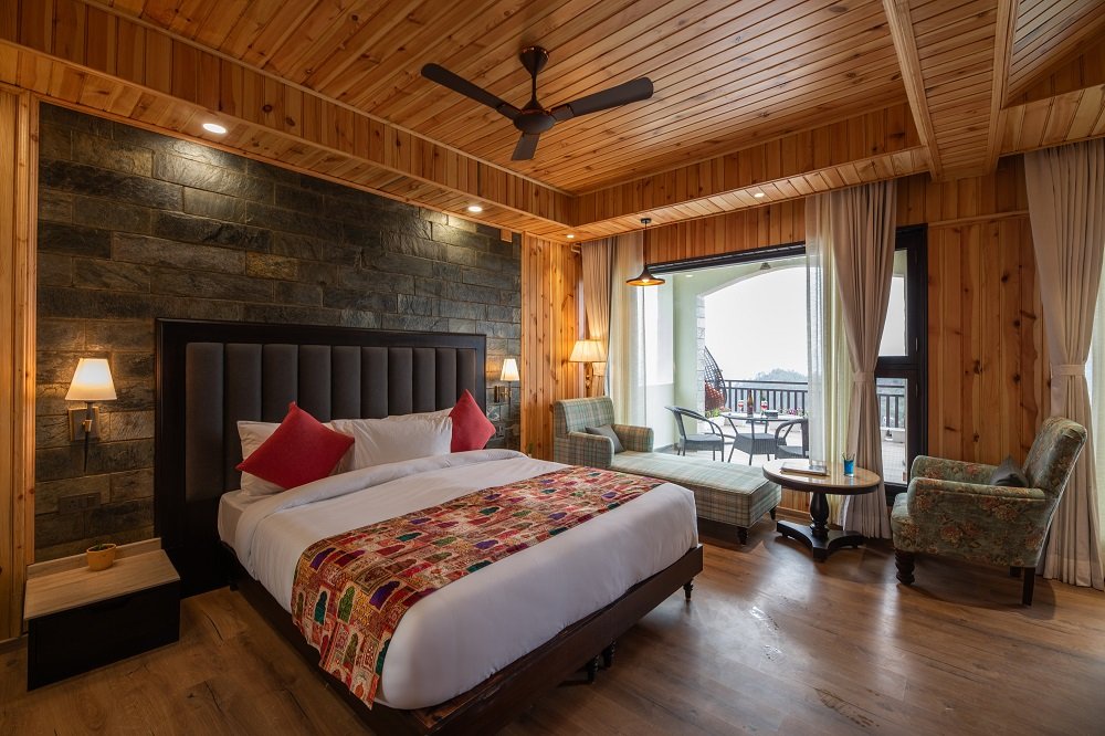 Buransh Retreat ultimate luxury suite at Ojaswi Resort Mukteshwar with sweeping 180-degree Himalayan mountain views.