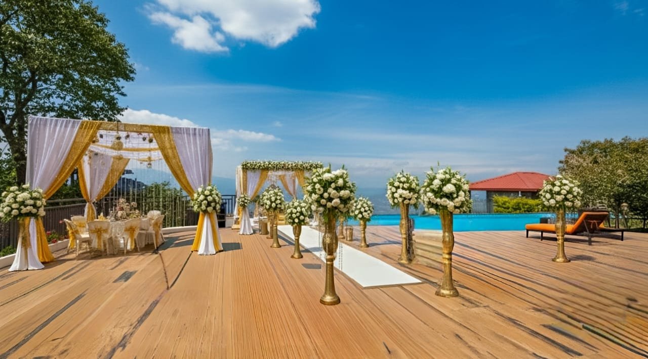 Outdoor pool side event space in Mukteshwar with scenic forest views, ideal for grand weddings and celebrations.